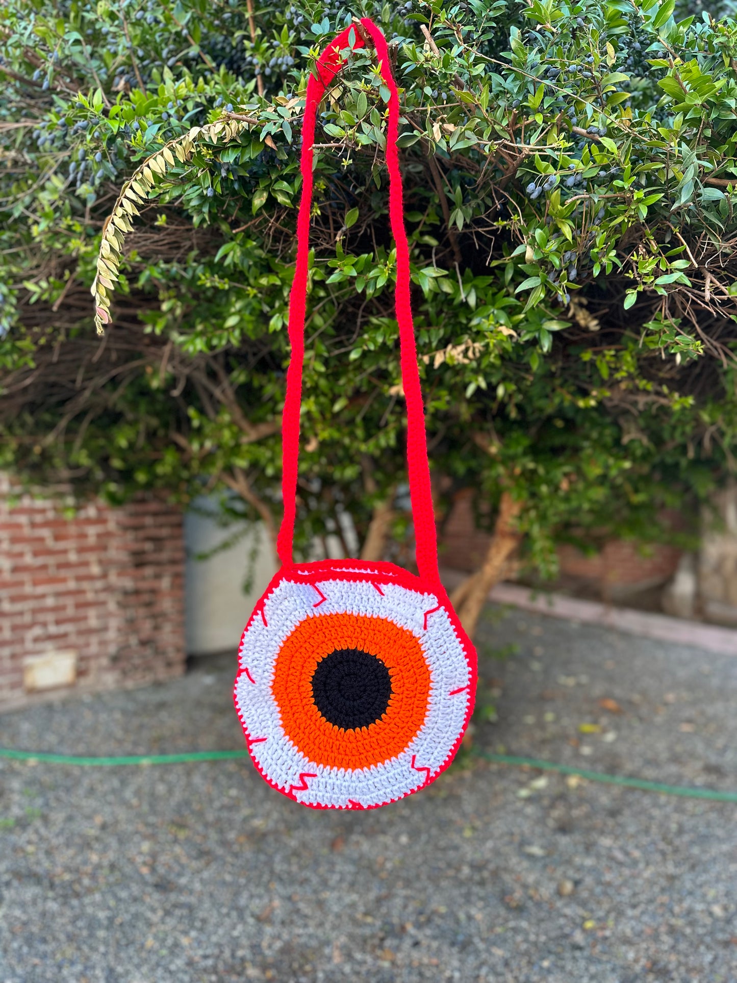 Bloodshot Purple and Orange Eye Crossbody Bag