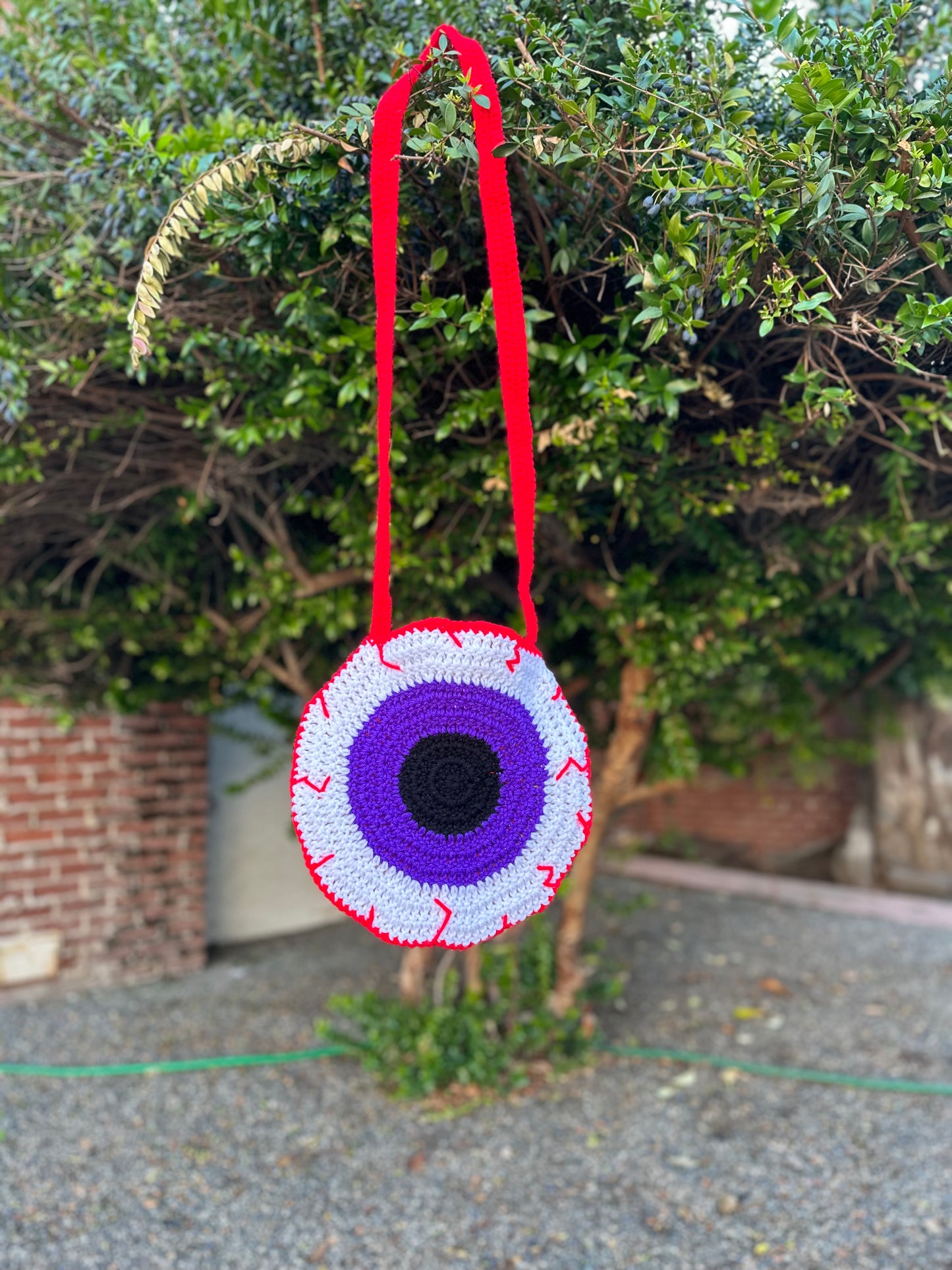 Bloodshot Purple and Orange Eye Crossbody Bag